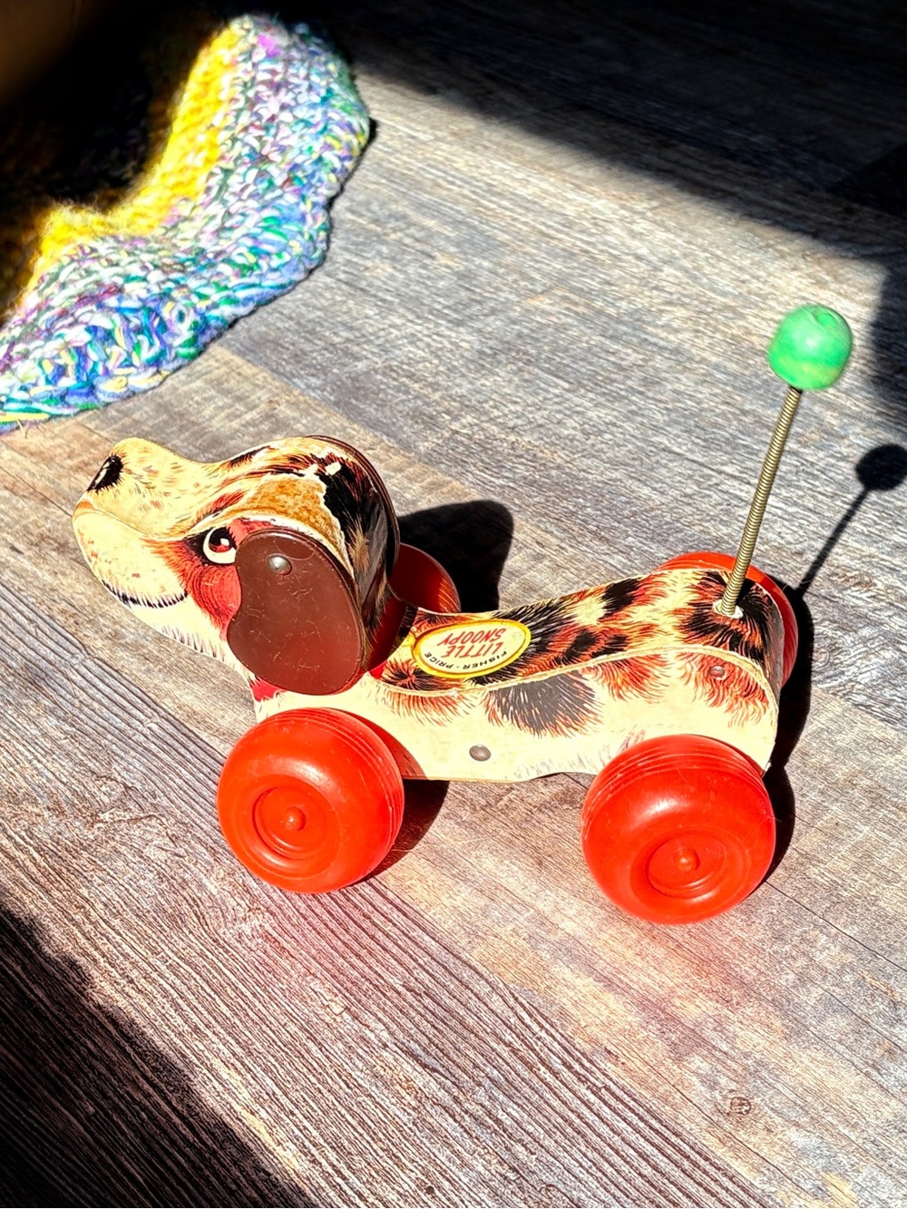 Fisher-Price Painted Pull-Along Dog Toy with Red Wheels and Green Tail Knob